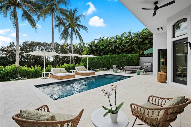 view of pool featuring ceiling fan, outdoor lounge area, and a patio