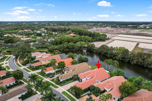 birds eye view of property featuring a water view