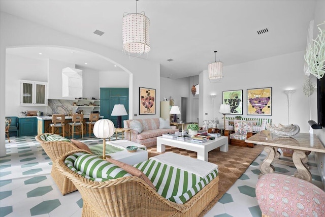 living room featuring an inviting chandelier