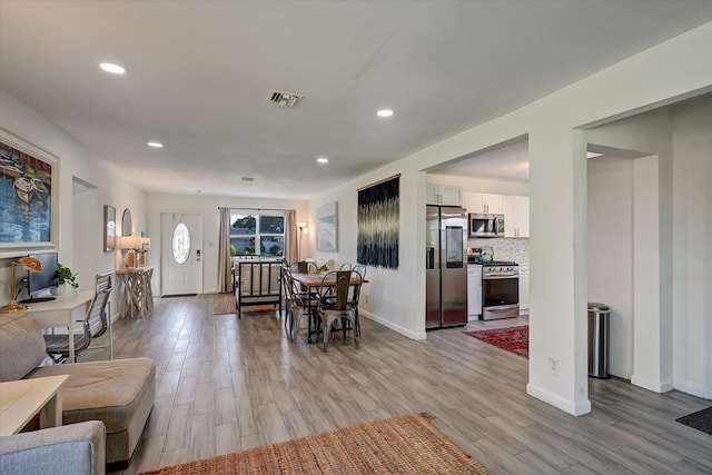 dining space featuring light hardwood / wood-style flooring