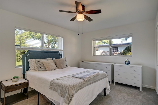 carpeted bedroom featuring ceiling fan