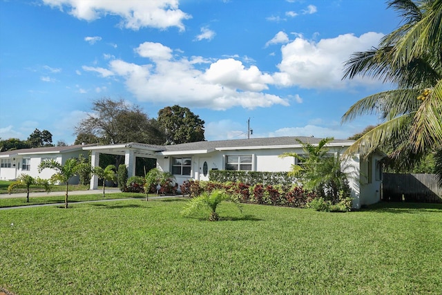 single story home featuring a front yard