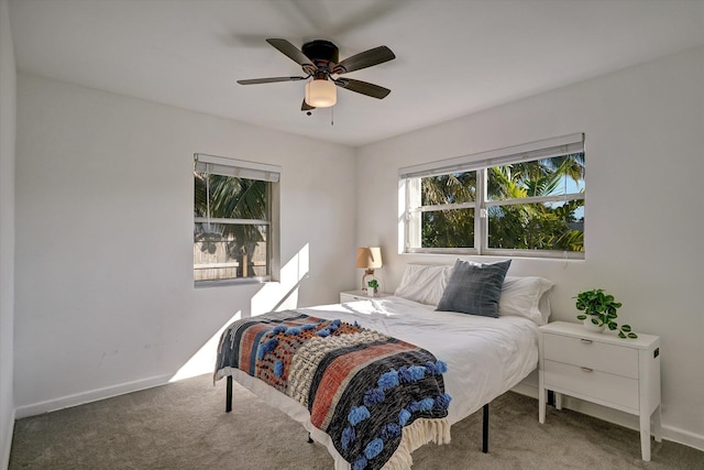 bedroom with ceiling fan and carpet