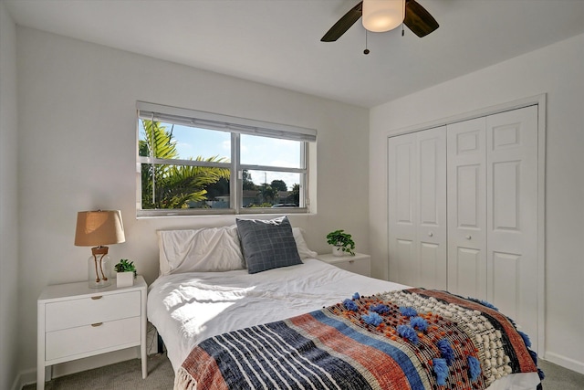 bedroom with a closet, ceiling fan, and carpet