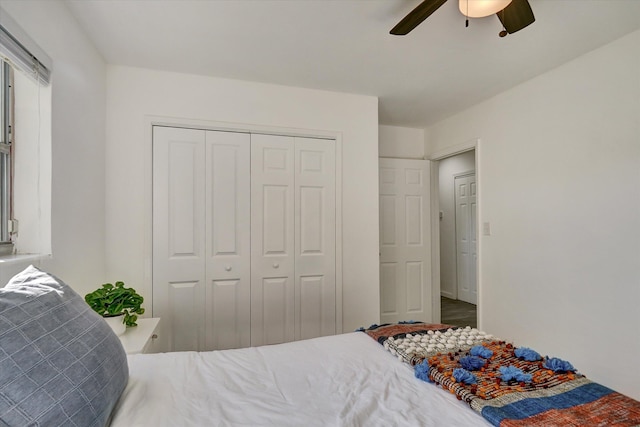 bedroom featuring ceiling fan and a closet