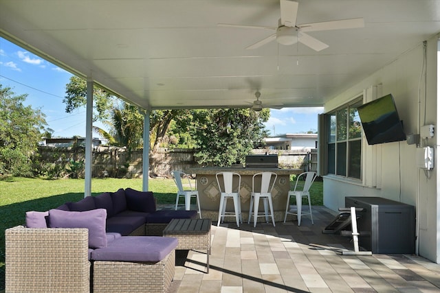 view of patio featuring an outdoor hangout area, an outdoor bar, and ceiling fan