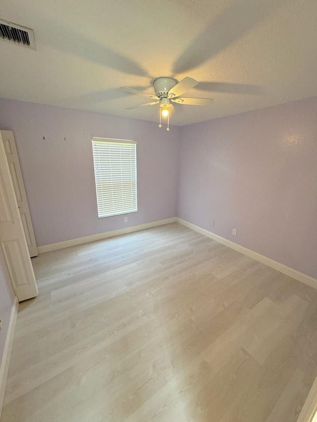 unfurnished room featuring ceiling fan and light hardwood / wood-style flooring