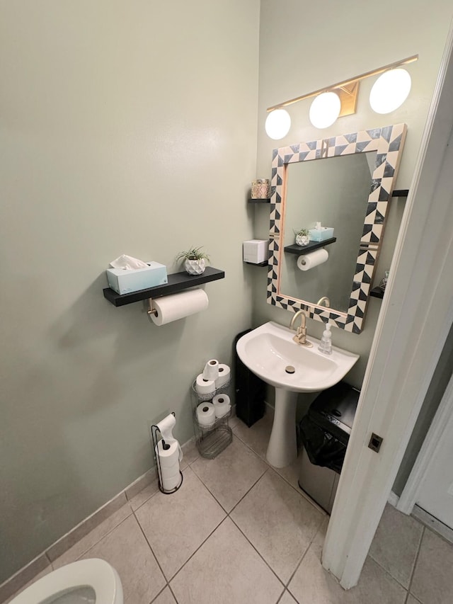 bathroom with tile patterned floors and toilet