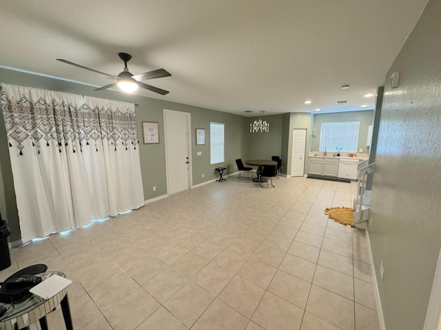 interior space featuring ceiling fan and light tile patterned flooring