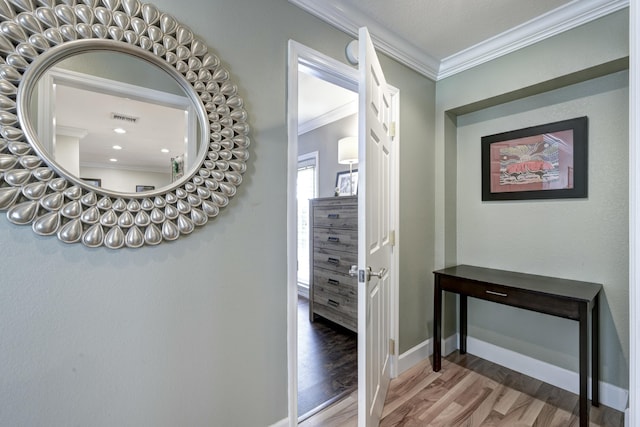 interior space with crown molding and hardwood / wood-style flooring