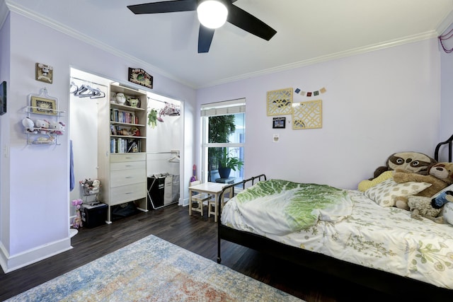 bedroom with crown molding, dark hardwood / wood-style floors, and ceiling fan