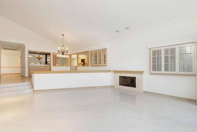 unfurnished living room with ornamental molding, lofted ceiling, a notable chandelier, and a fireplace