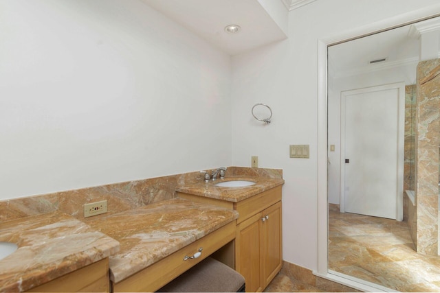 bathroom featuring vanity and crown molding