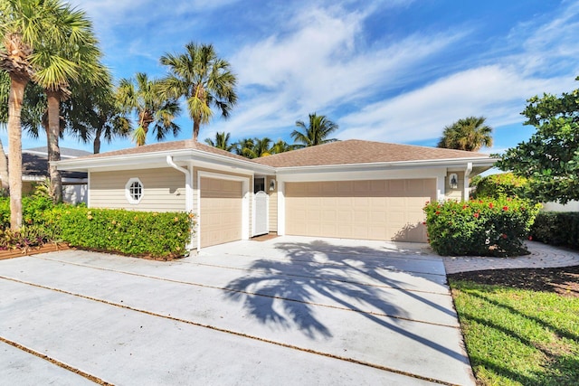 ranch-style house featuring a garage