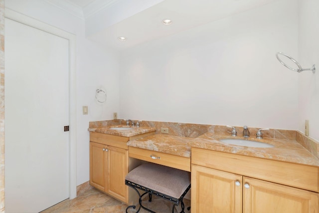 bathroom featuring vanity and ornamental molding