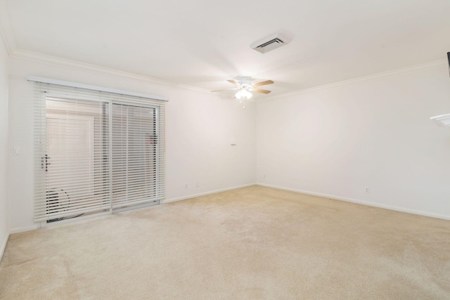 carpeted spare room featuring ornamental molding and ceiling fan