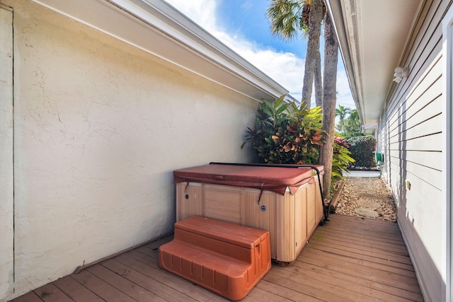 deck with a hot tub