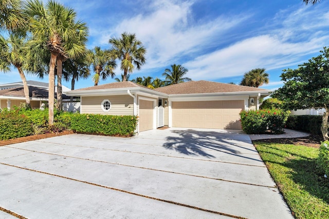 single story home featuring a garage