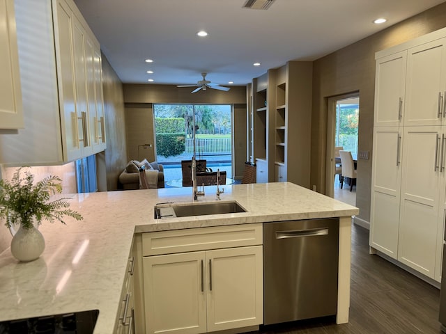 kitchen with sink, stainless steel dishwasher, plenty of natural light, kitchen peninsula, and light stone countertops