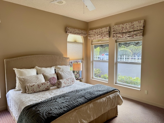 carpeted bedroom with a textured ceiling