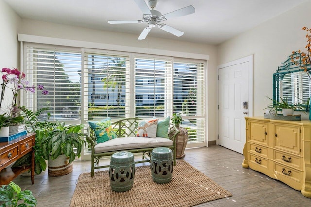 sitting room featuring ceiling fan and hardwood / wood-style floors