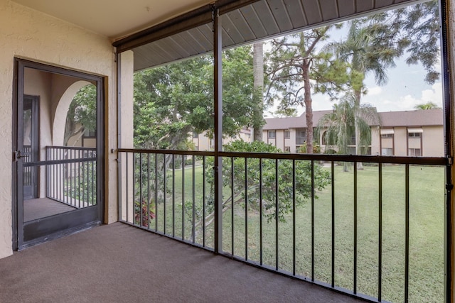 unfurnished sunroom with a wealth of natural light