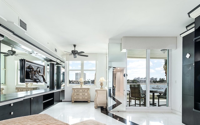 interior space featuring a wealth of natural light, visible vents, marble finish floor, and vanity