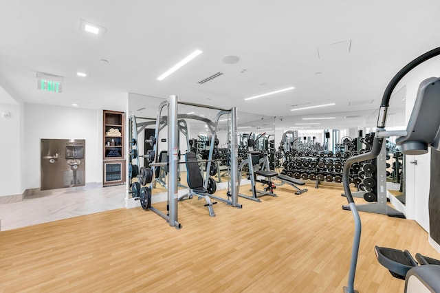 workout area featuring wood finished floors