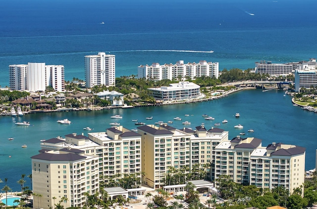 birds eye view of property featuring a water view and a city view