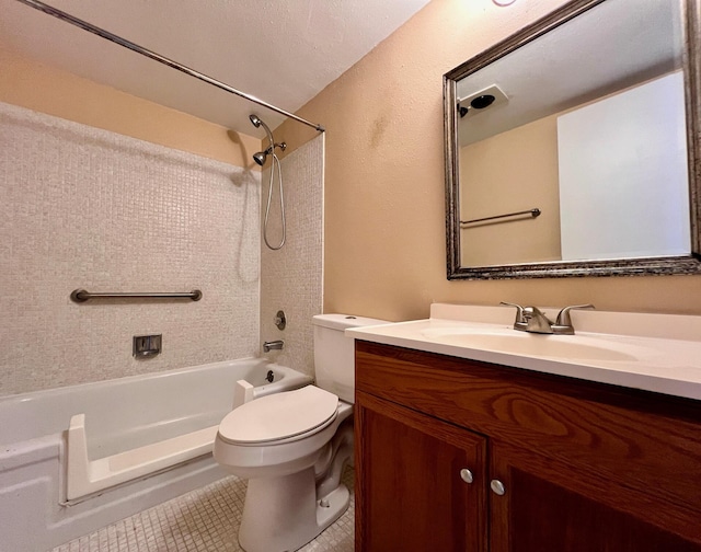 full bathroom with vanity, tiled shower / bath combo, tile patterned floors, and toilet