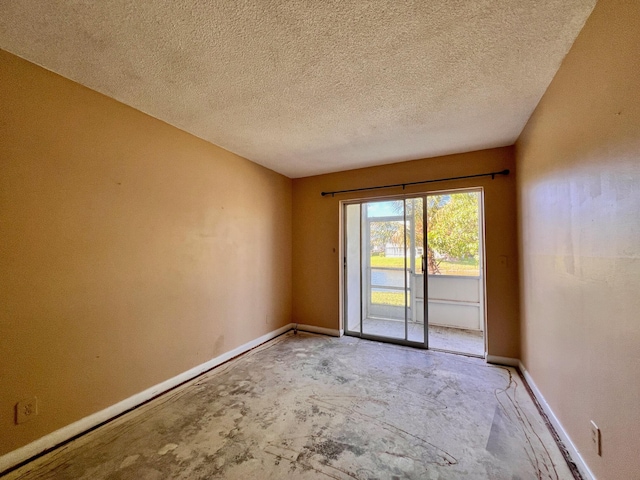 empty room with a textured ceiling