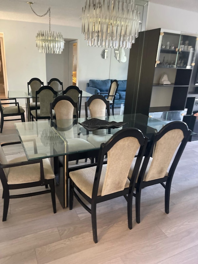 dining room featuring an inviting chandelier and hardwood / wood-style floors