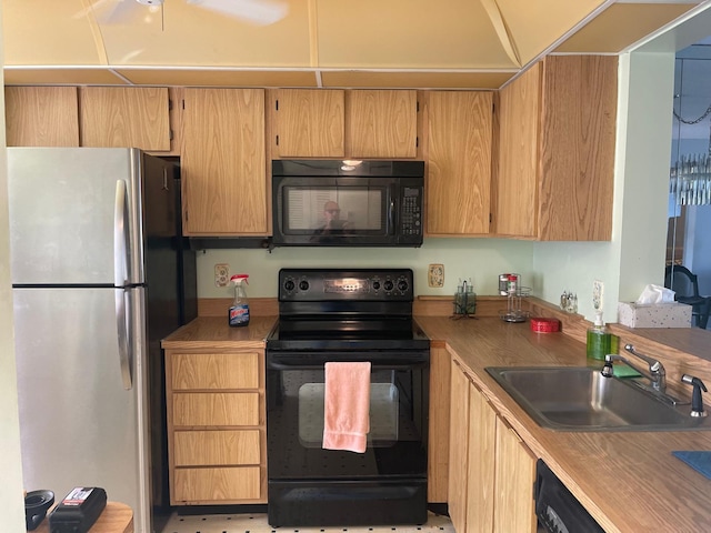 kitchen with sink and black appliances