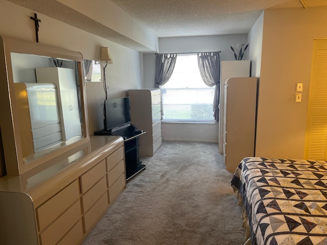 carpeted bedroom with a textured ceiling