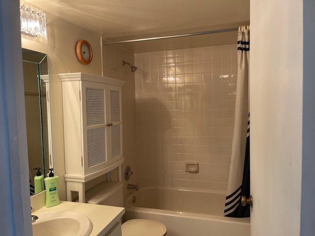 full bathroom with shower / tub combo with curtain, vanity, and toilet