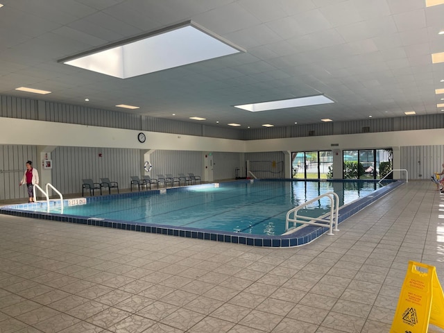 view of pool featuring a skylight