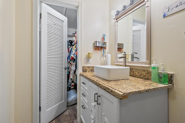 bathroom featuring vanity and wood-type flooring