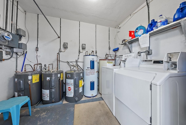 interior space featuring water heater and washing machine and clothes dryer