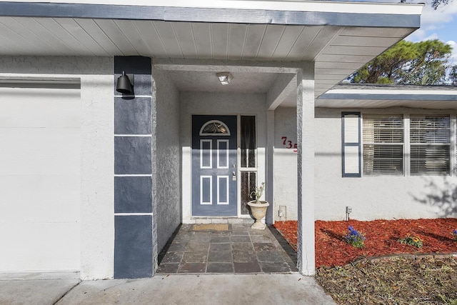 property entrance featuring a garage