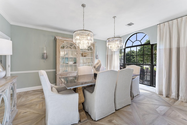 dining room with a notable chandelier, ornamental molding, and light parquet flooring