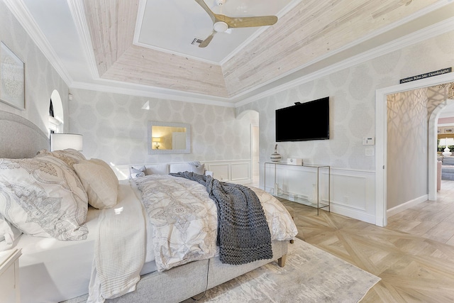 bedroom featuring light parquet floors, ornamental molding, and ceiling fan