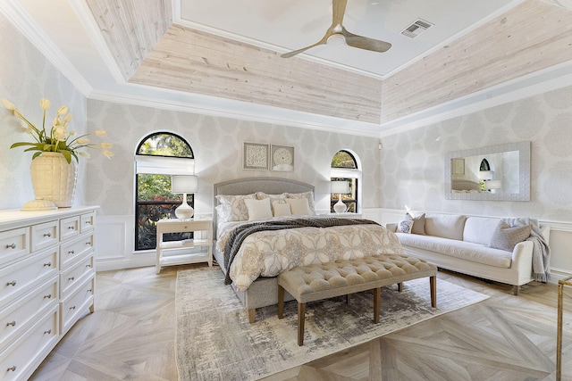 bedroom featuring crown molding, ceiling fan, and light parquet flooring