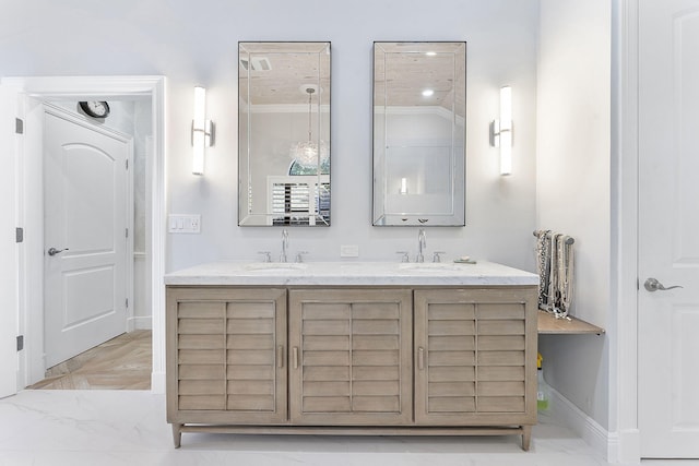 bathroom with vanity and ornamental molding