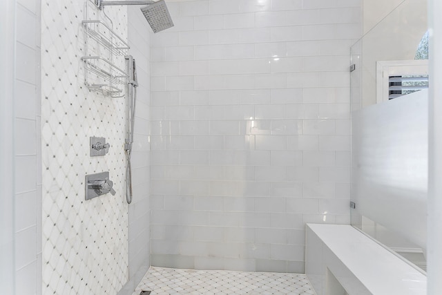 bathroom with tiled shower