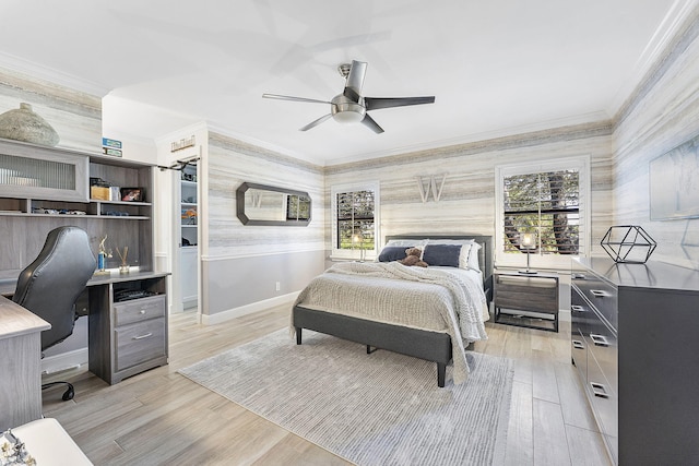 bedroom with multiple windows, ornamental molding, and light wood-type flooring