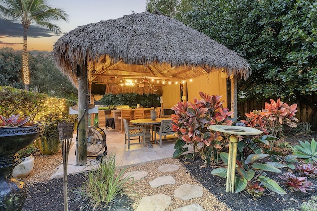 patio terrace at dusk with a gazebo