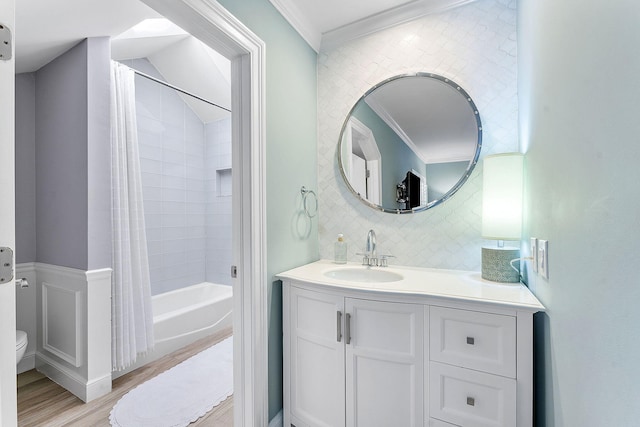 full bathroom featuring tasteful backsplash, ornamental molding, wood-type flooring, and shower / bath combination with curtain