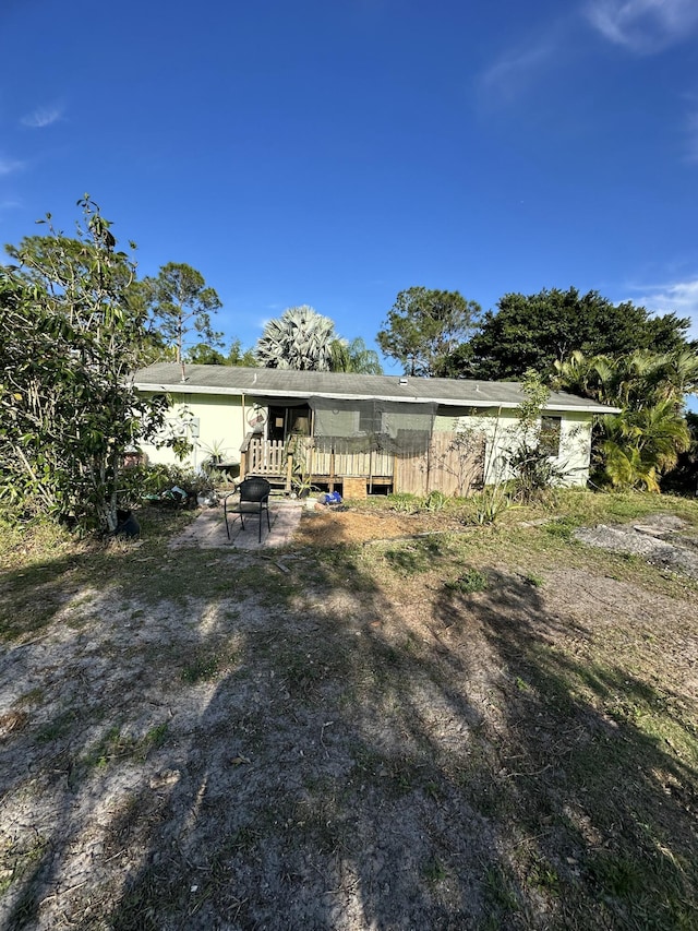 rear view of house with a deck