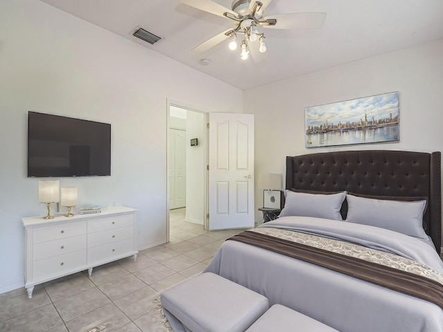 tiled bedroom with ceiling fan