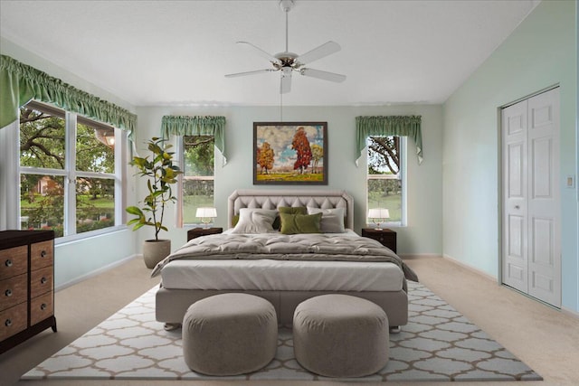 bedroom featuring multiple windows, vaulted ceiling, and carpet